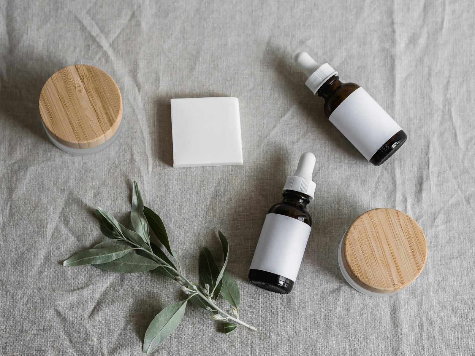 Skincare products flat lay on marble surface